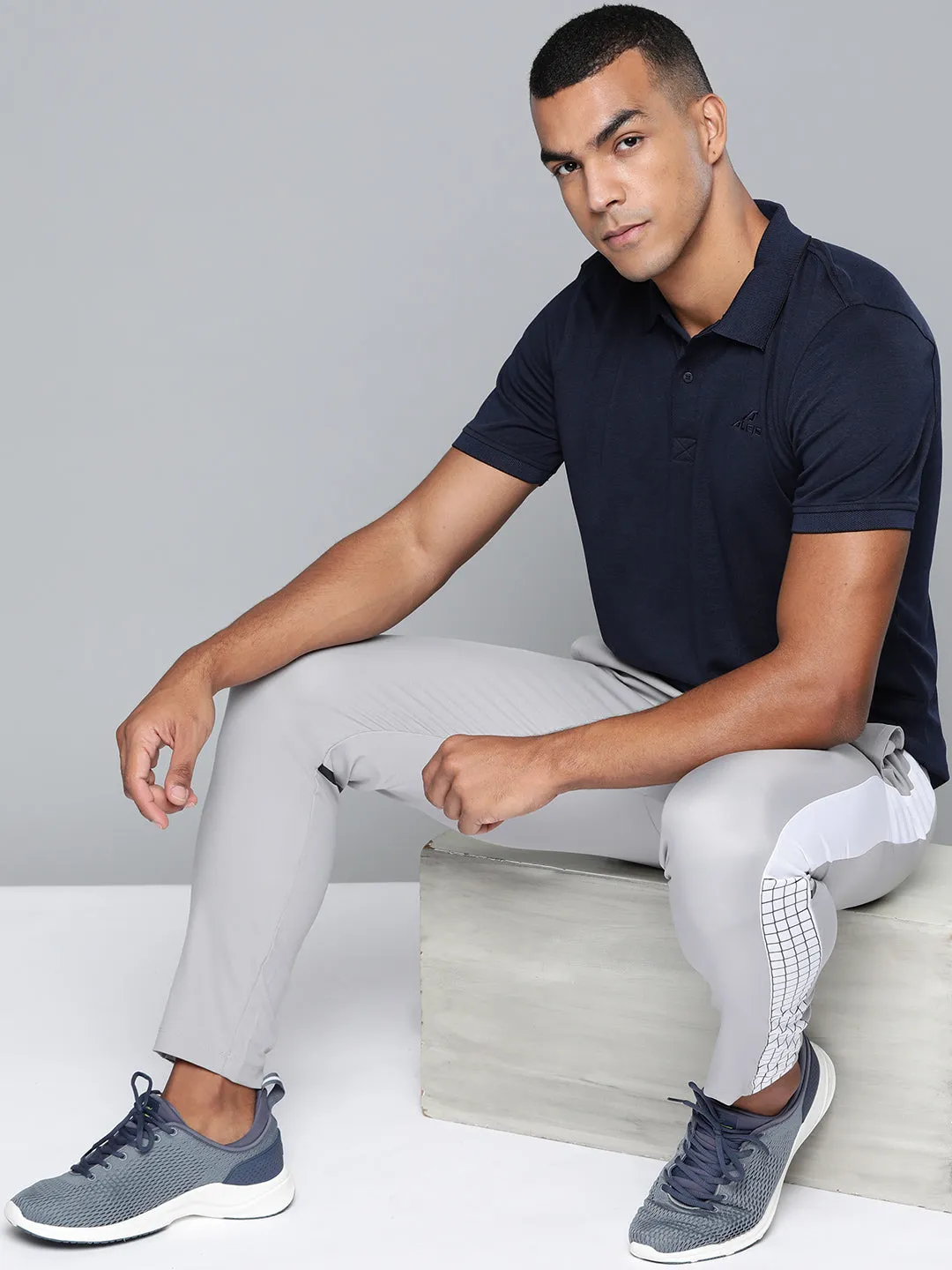 Alcis Men Navy Blue Solid Polo Collar T-shirt